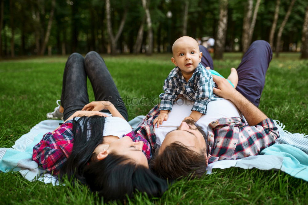 Similar – Father and daughter playing at the park at the day time.