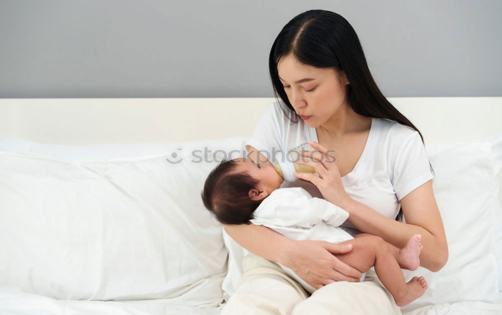 Similar – Mother breastfeed baby