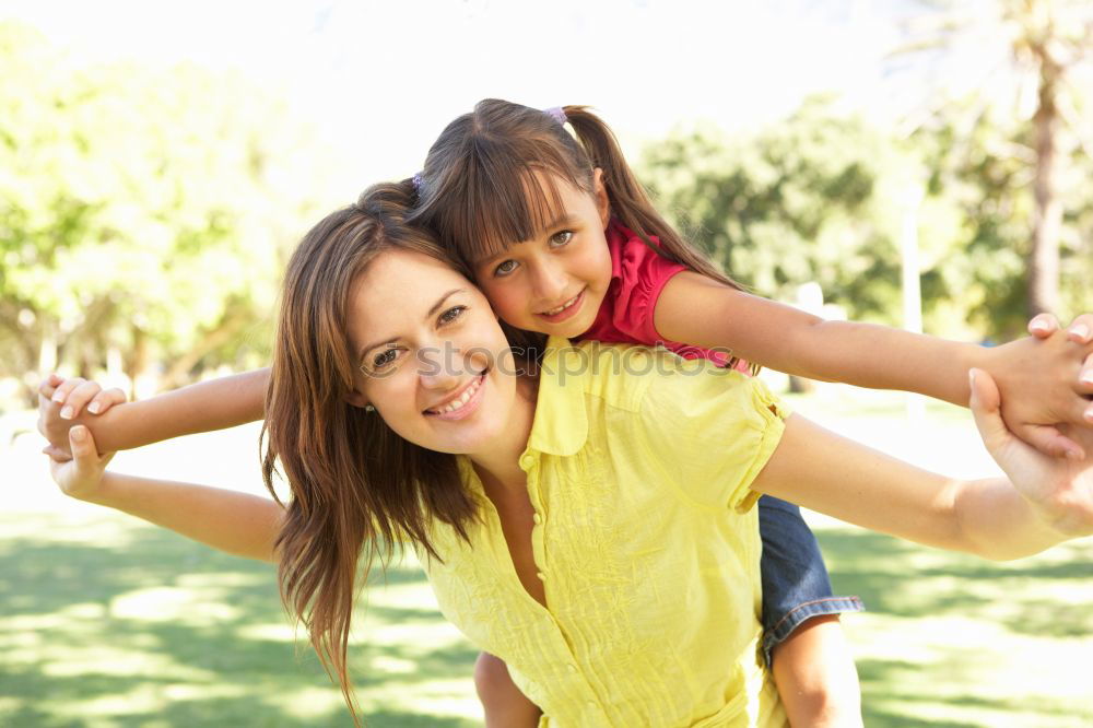 Similar – Image, Stock Photo Mother and son seated on a park