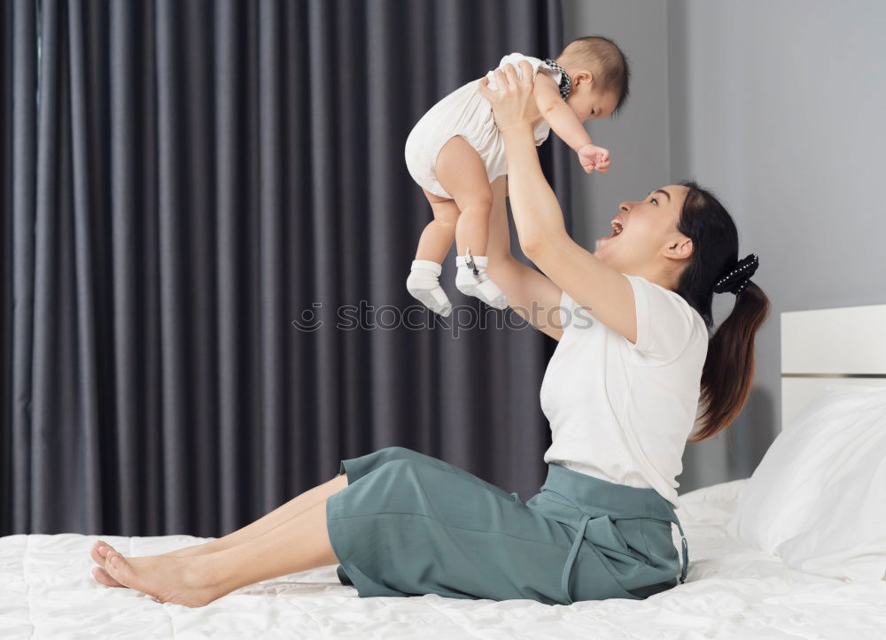 Similar – caucasian mother and son relaxing together on couch at home