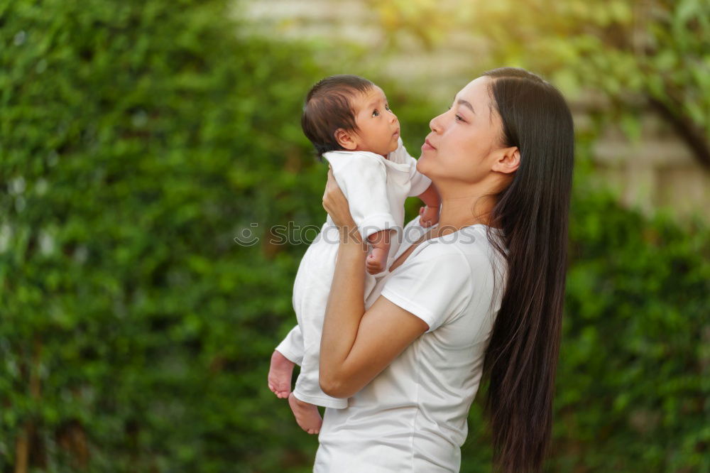 Similar – Image, Stock Photo mother holding happy baby in the garden