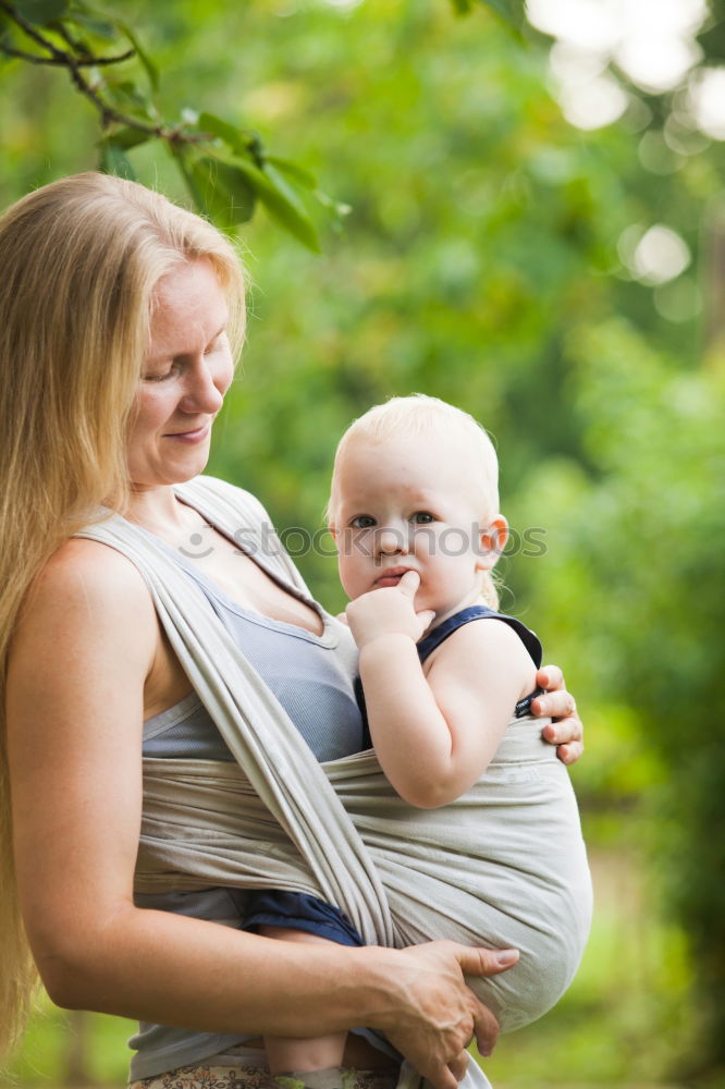 Similar – Image, Stock Photo Mother sitting with kid on hands