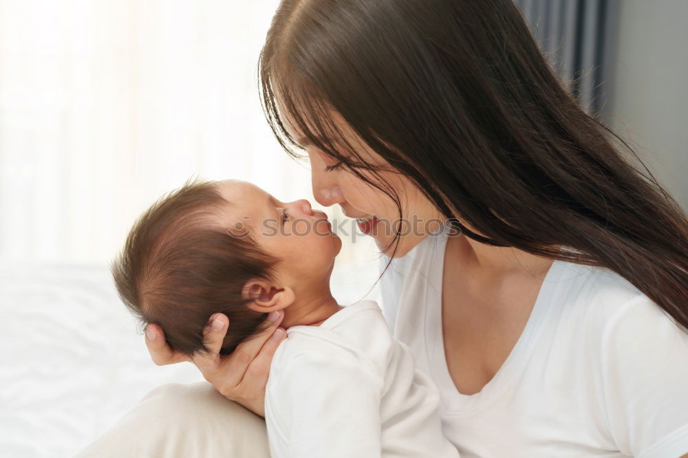 Similar – happy mother hugs her toddler son