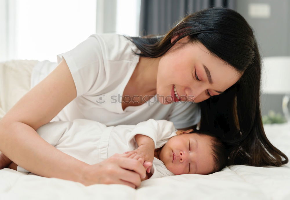 Similar – Mother breastfeed baby