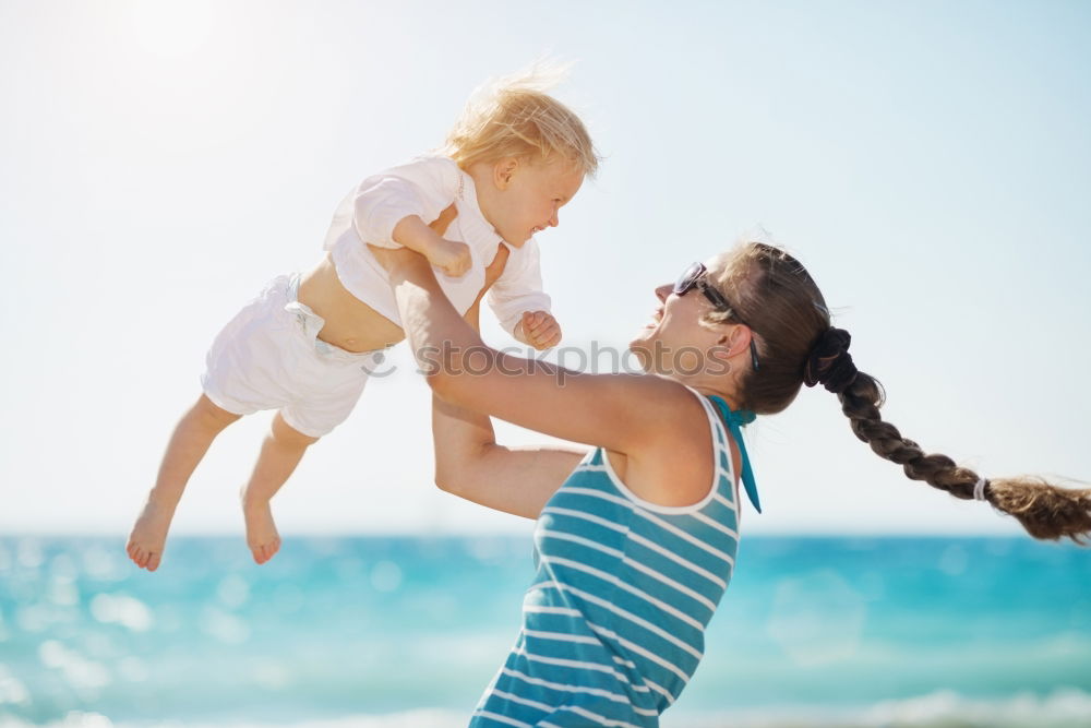 Similar – Sister and brother playing on the beach