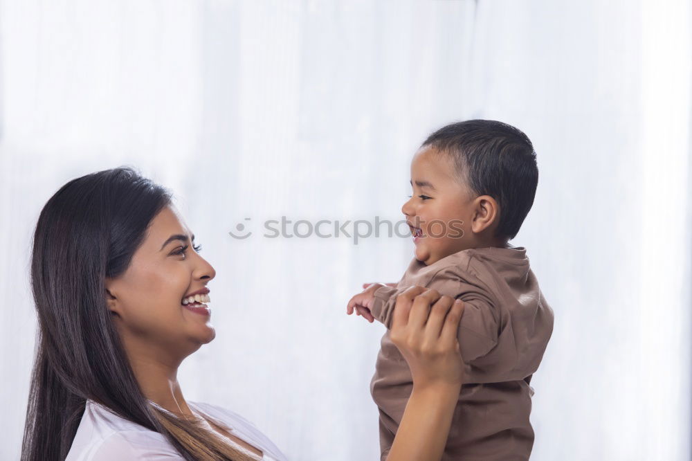 Similar – mother kissing little baby at bar terrace