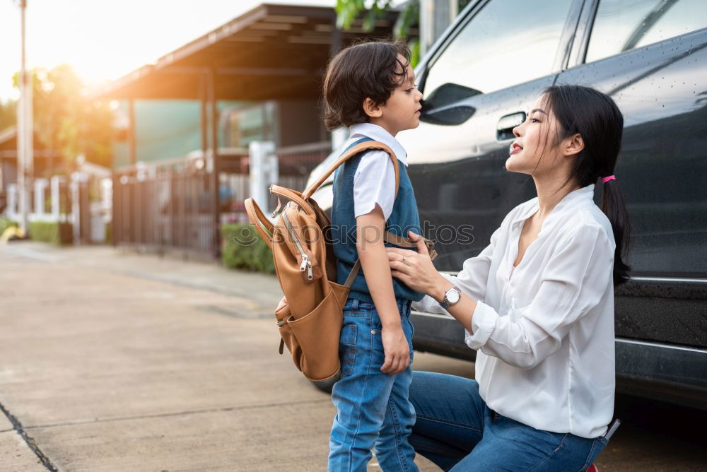 Similar – Foto Bild Familie mit Notfallrucksäcken verlässt schnell ihre Haustür