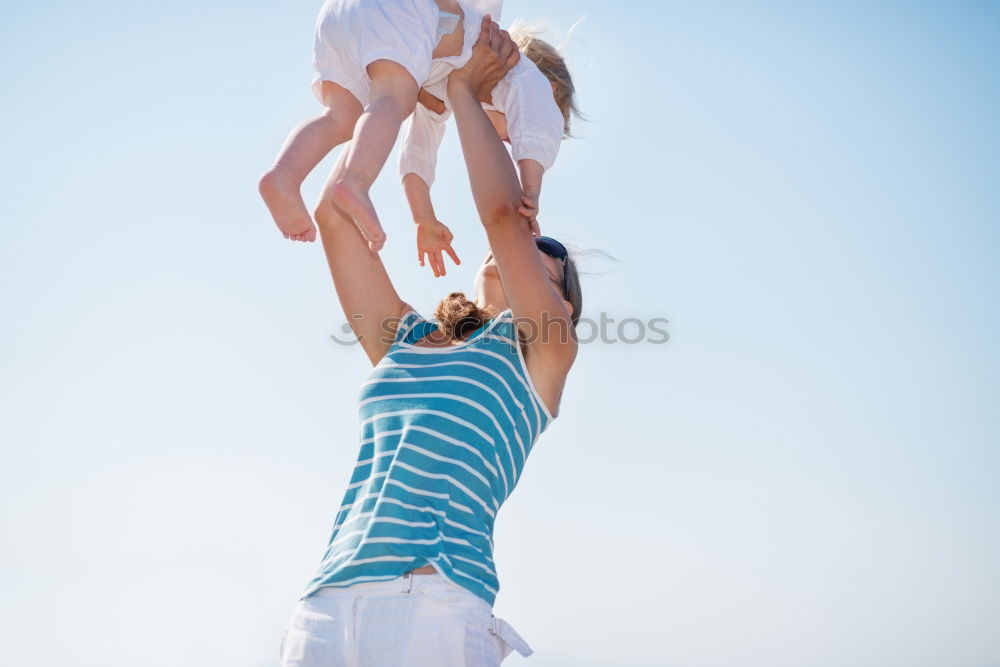 Similar – Father and son playing on the beach at the day time. Concept of friendly family.