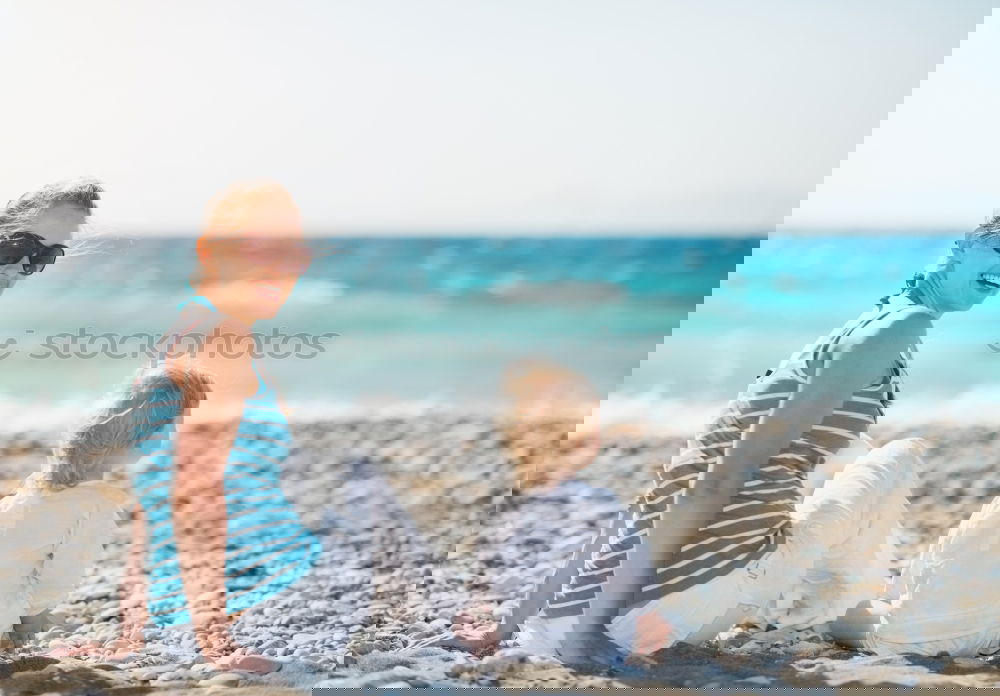 Similar – Image, Stock Photo Happy children playing on the beach at the day time.