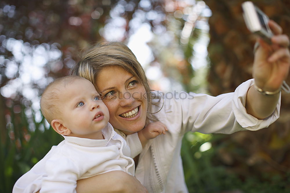 Similar – Grandma has her grandson on her arm