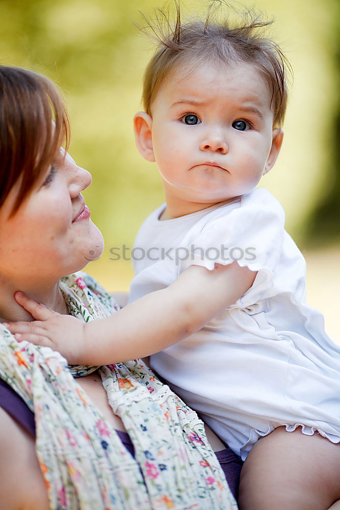 Similar – Image, Stock Photo Muslim mother holding a little baby by arms in outdoor area