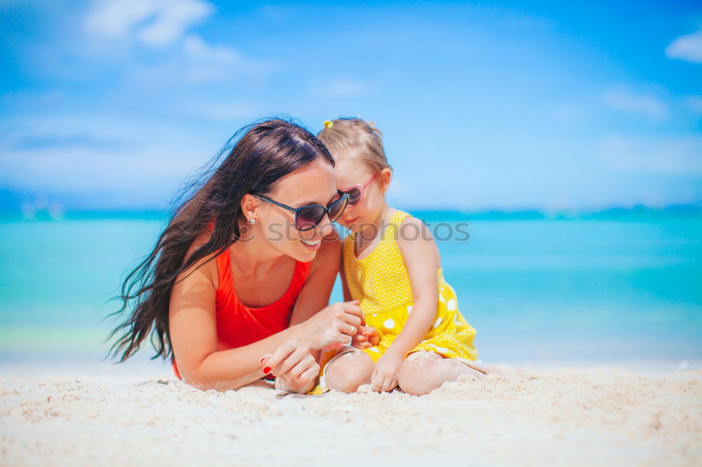 Similar – Image, Stock Photo Mother and toddler son playing with toys at beach