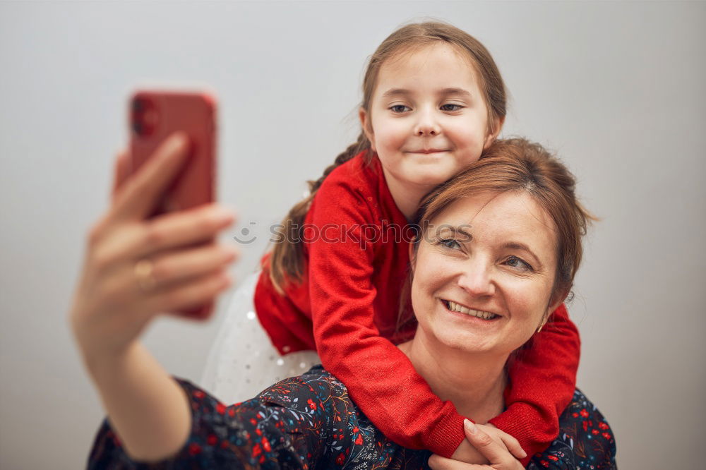 Similar – happy mother and daughter making selfie outdoor