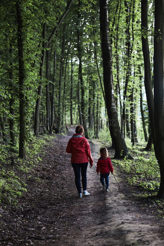 Similar – Image, Stock Photo Mother with her little daughter walking through the forest