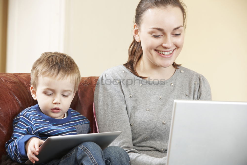 Similar – happy mother and toddler son using tablet