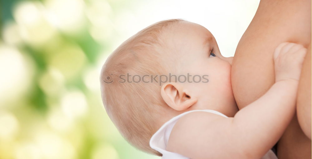 Father holding newborn baby son at the day time. Concept of happy family.