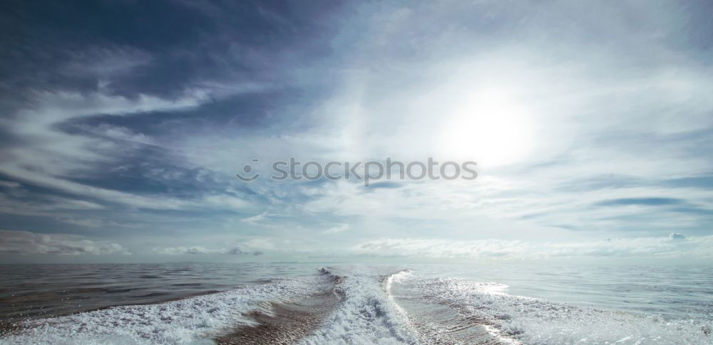 Similar – A young person on the beach of Hiddensee in bright sunshine