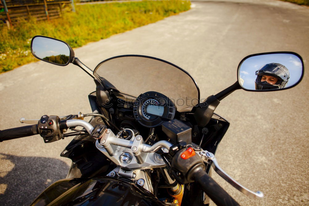 Similar – Man on bike looking away