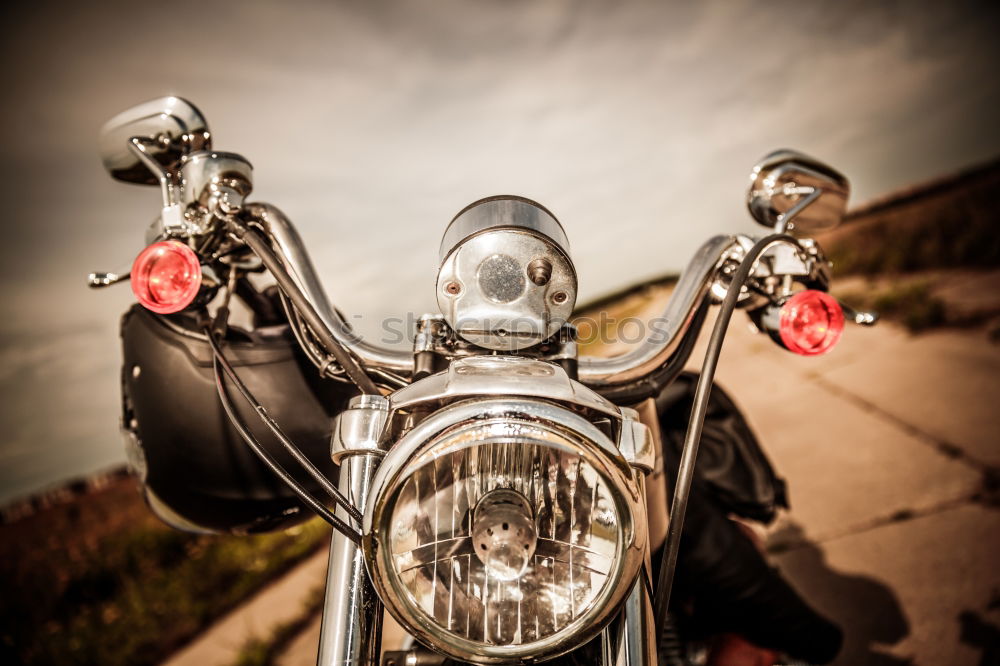 Similar – Man standing near motorcycle