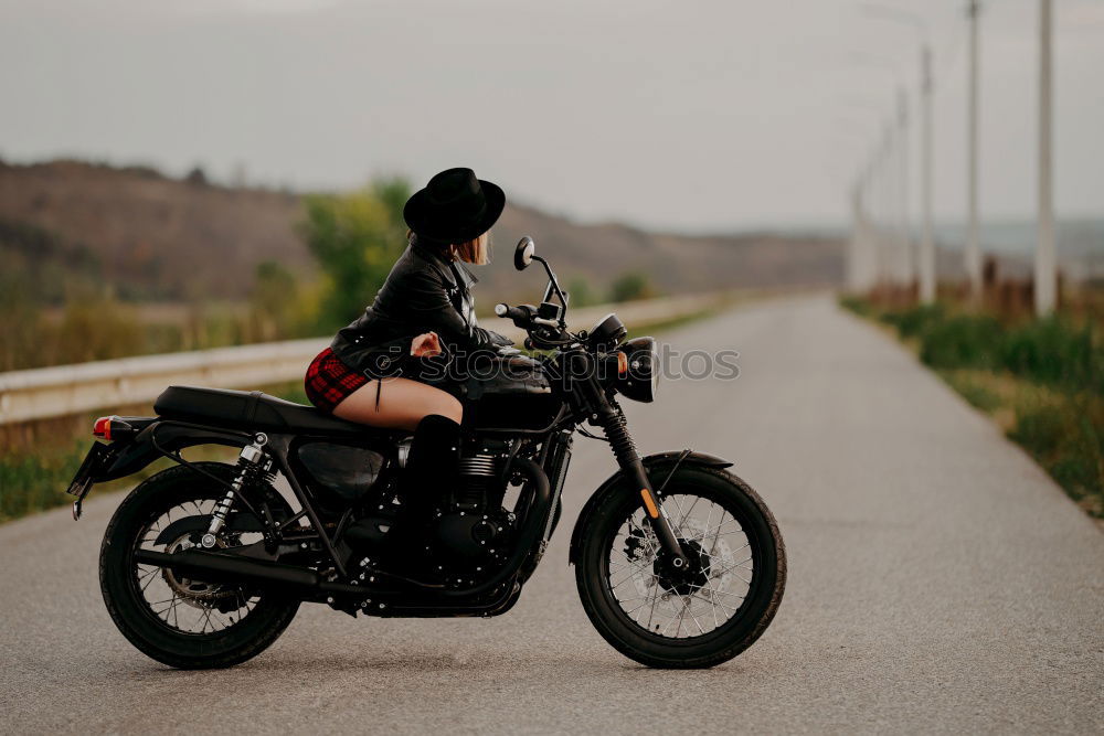 Similar – Motorcycle on background of landscape