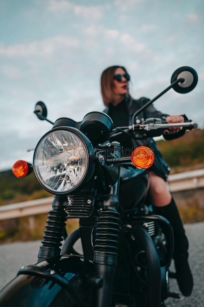 Similar – Man standing near motorcycle