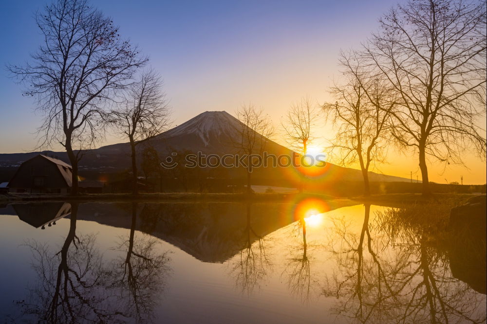 Similar – Alpine village under sun rays