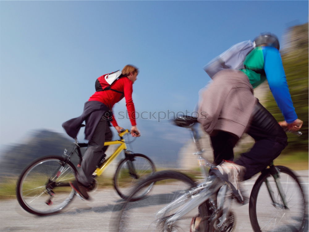 Women riding bikes in countryside