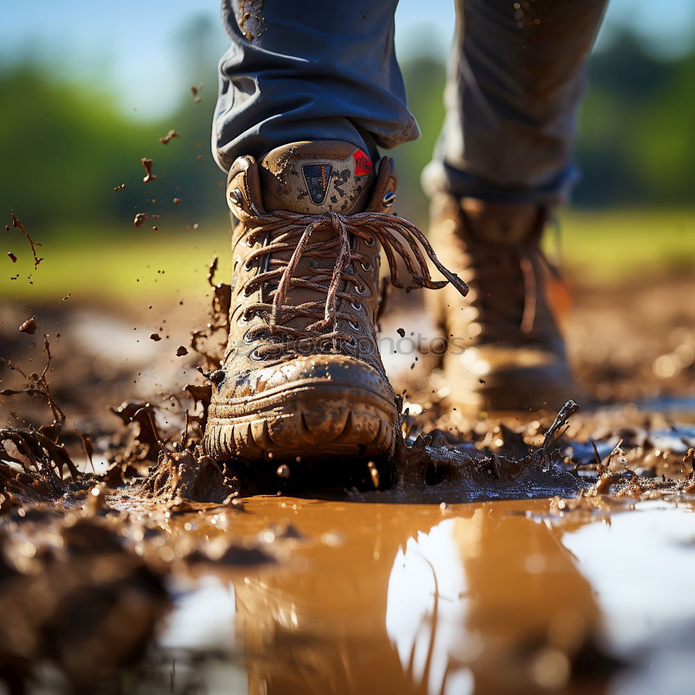 Similar – Image, Stock Photo Legs in leather boots in puddle