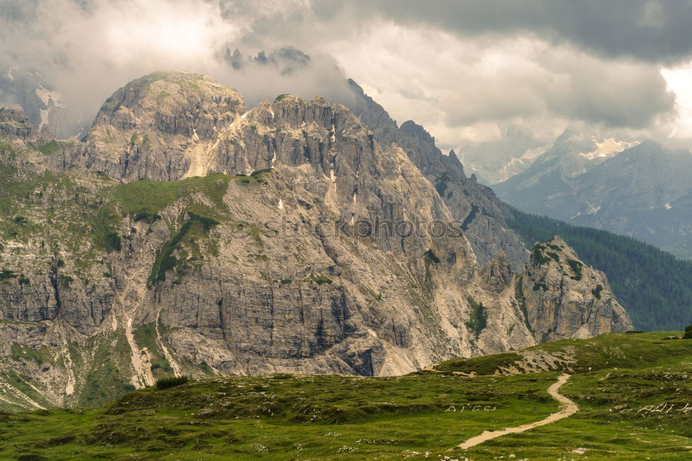 Similar – Image, Stock Photo Clouds and shadows in the Dolomites with path in portrait format