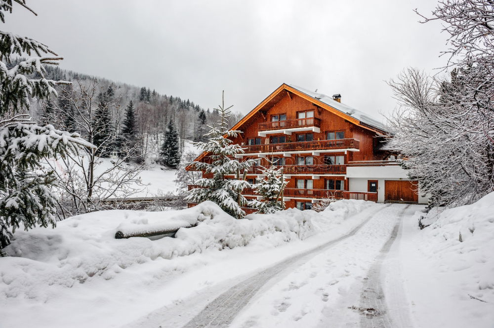 Similar – Snowfall over Austrian mountain village