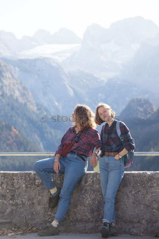 Similar – Women at lake in mountains