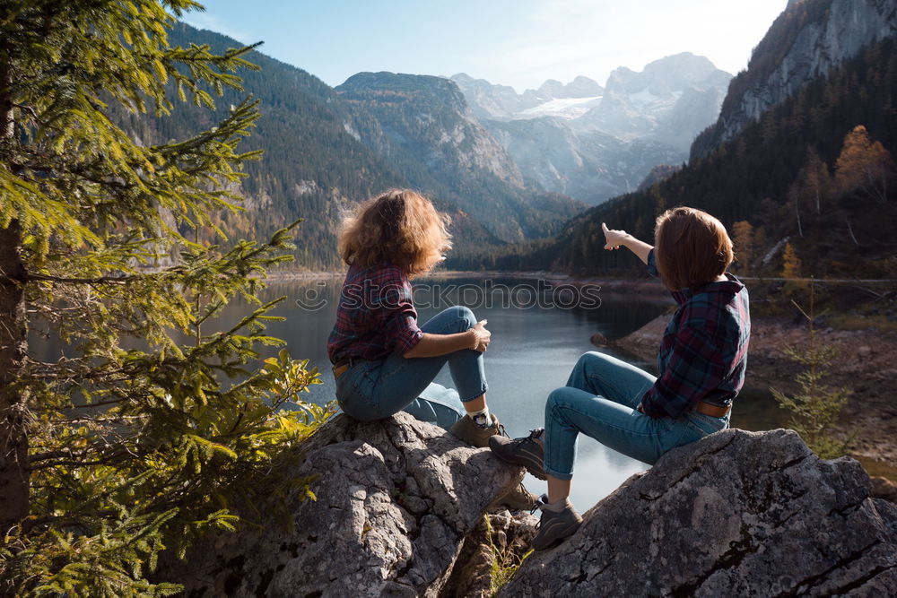 Similar – Women at lake in mountains