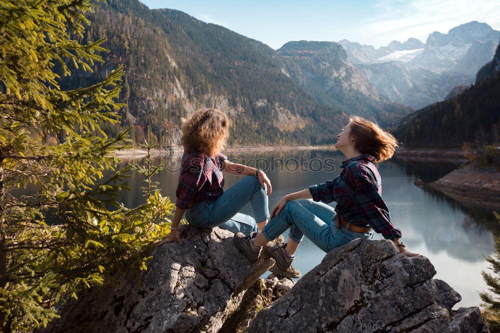 Similar – Women at lake in mountains