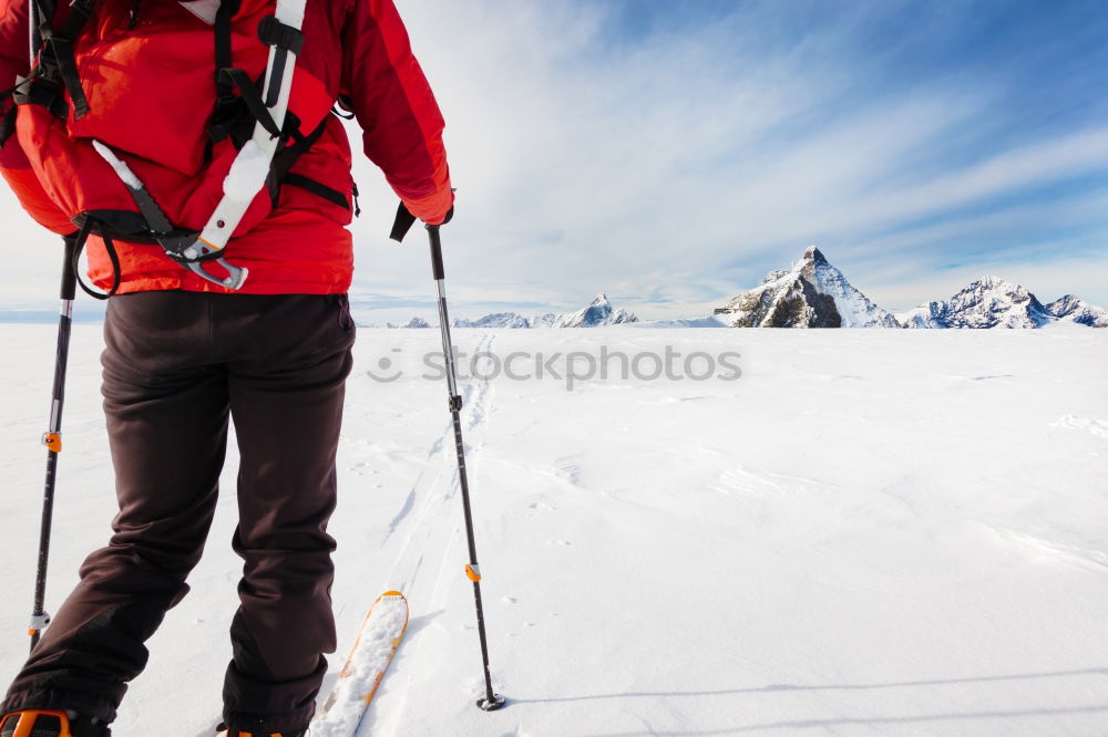 Similar – Image, Stock Photo Skier with rucksack in a snowy landscape, looking backwards