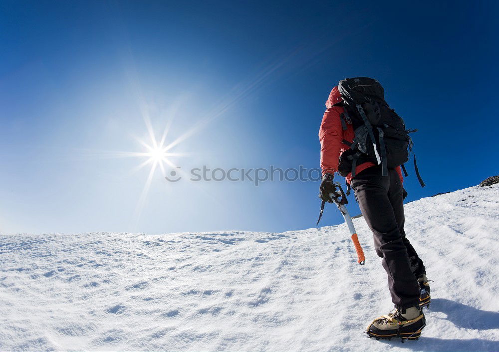 Similar – Image, Stock Photo Mountaineer reaches the top of a snowy mountain