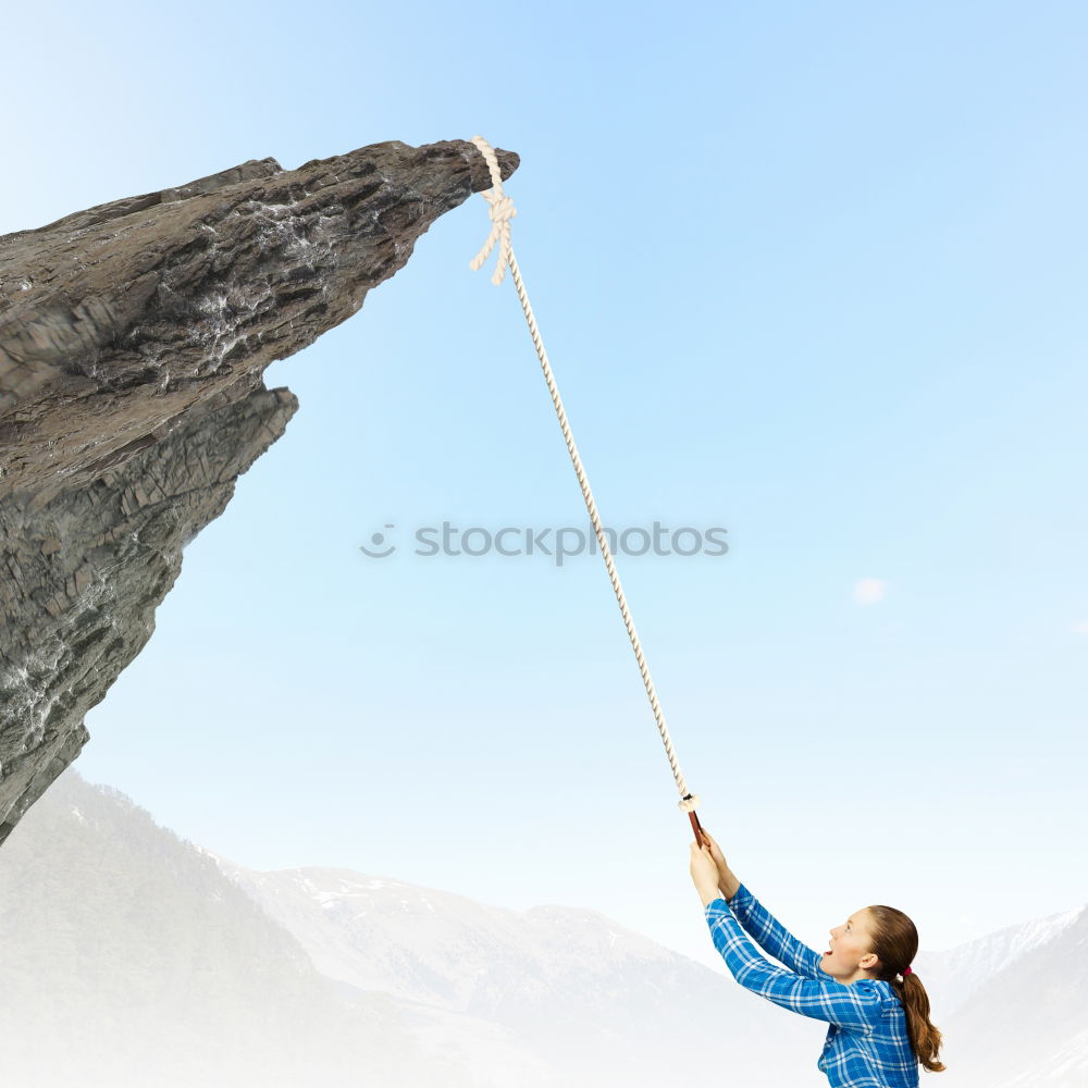 Similar – Image, Stock Photo Anonymous climber handing on cliff