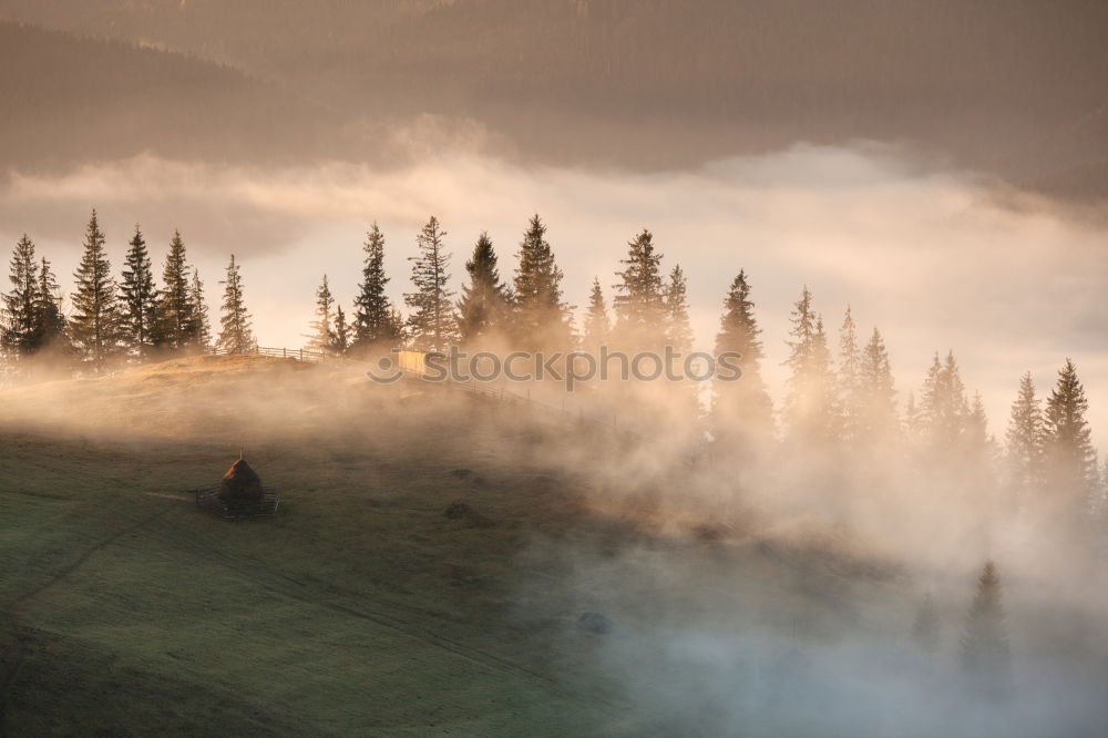 Similar – Alpine village in mountains. Smoke, bonfire and haze