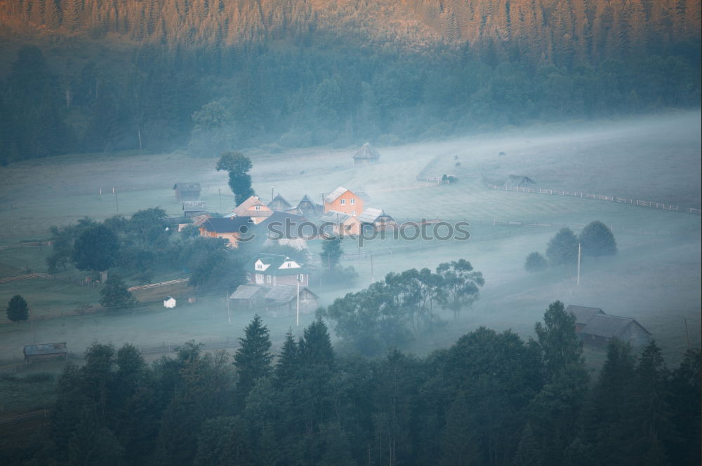 Similar – Alpine village in mountains. Smoke, bonfire and haze