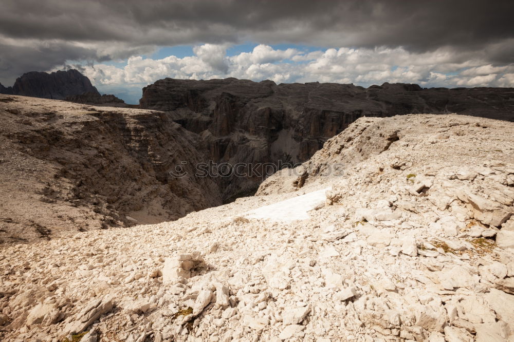 Similar – A vast expanse of fields and mountains full of trees taken from the top of a cliff