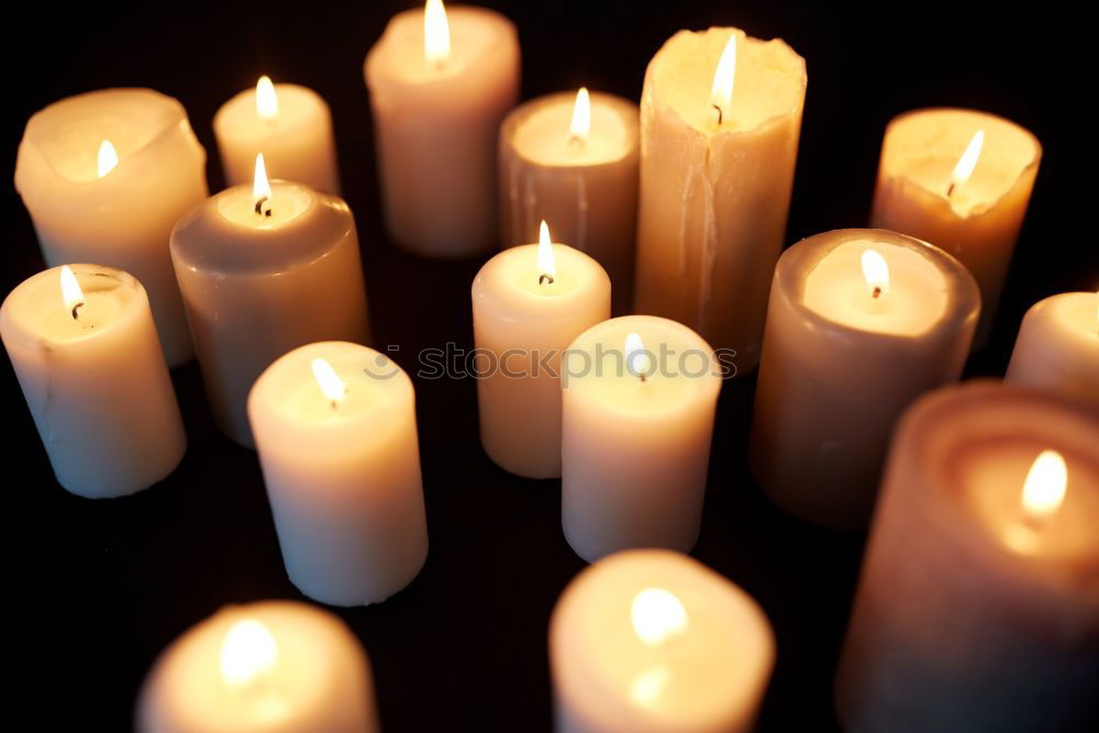 Similar – Image, Stock Photo A match lights the fire of many candles