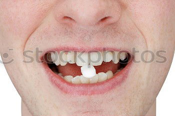 Similar – Close-up of a female mouth with vampire teeth and tongue