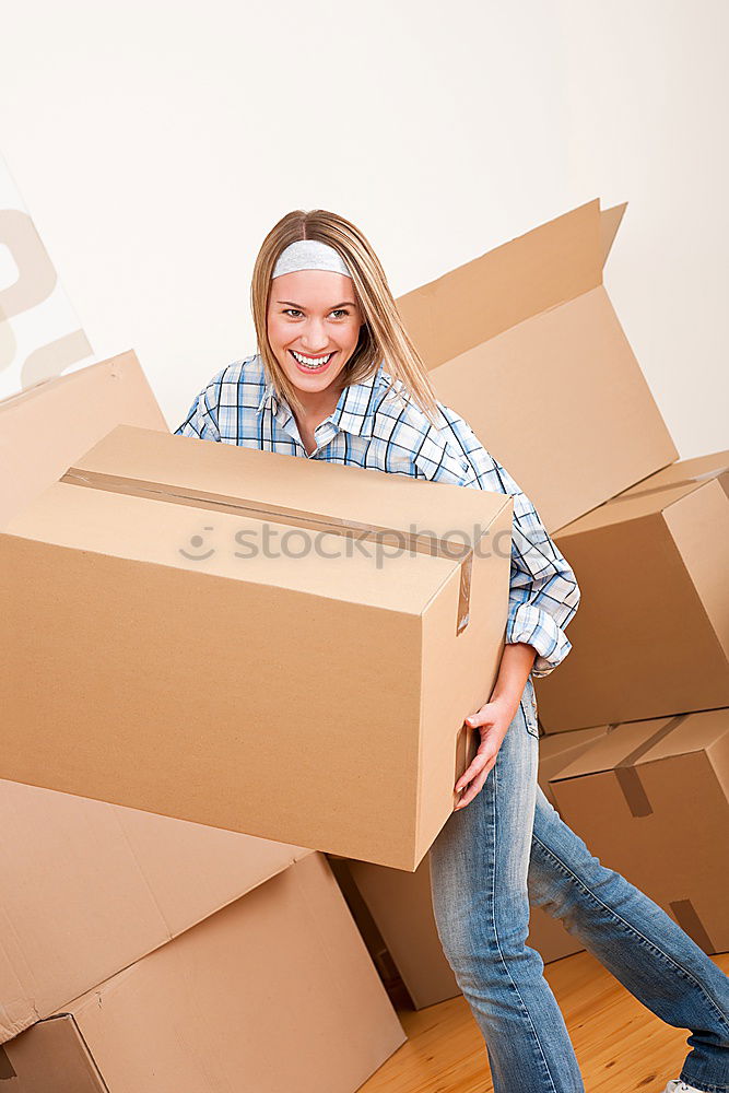 Similar – young woman sits in moving box