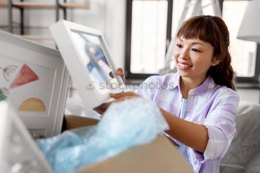 Similar – Image, Stock Photo Young woman with very short haircut with smart phone