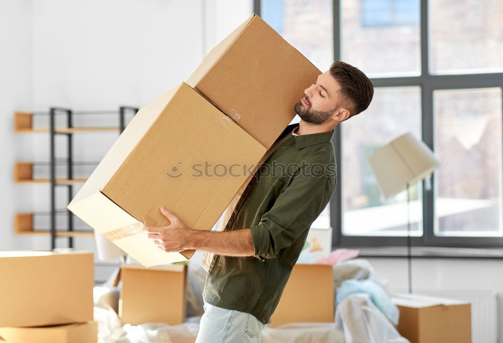 Similar – Man carrying moving boxes