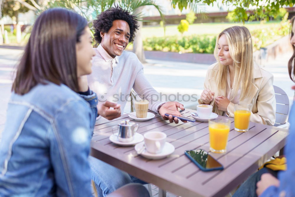 Similar – Image, Stock Photo Multiracial group of five friends having a coffee together.