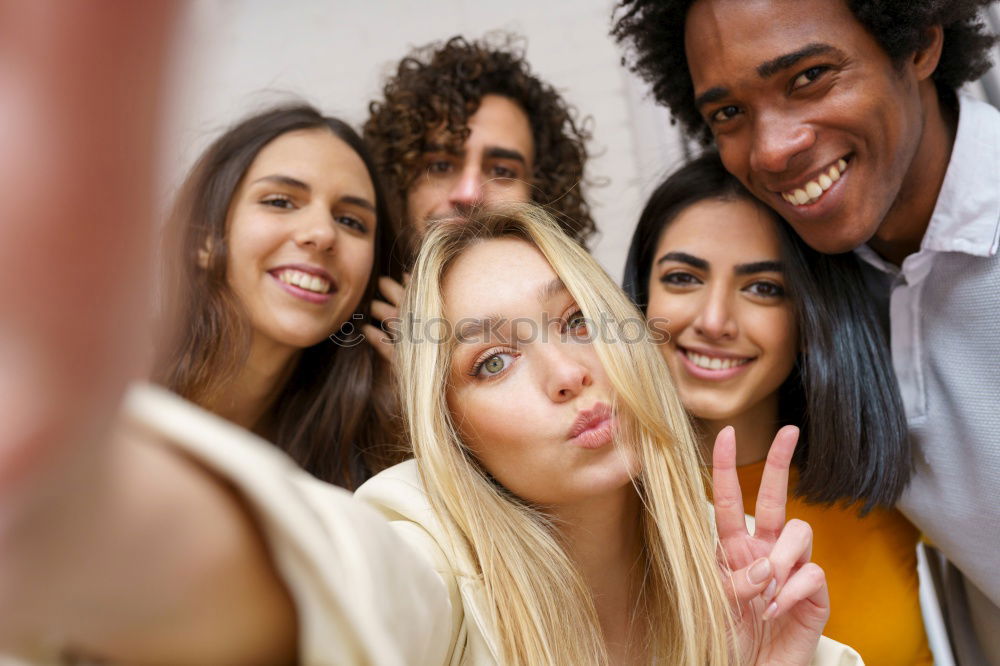 Similar – Image, Stock Photo Multiracial group of friends taking selfie in a urban street with a blonde woman in foreground