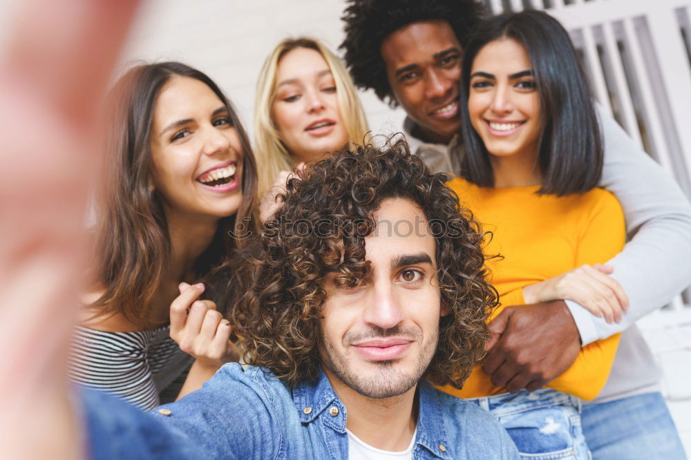 Multiracial group of friends taking selfie in a urban park