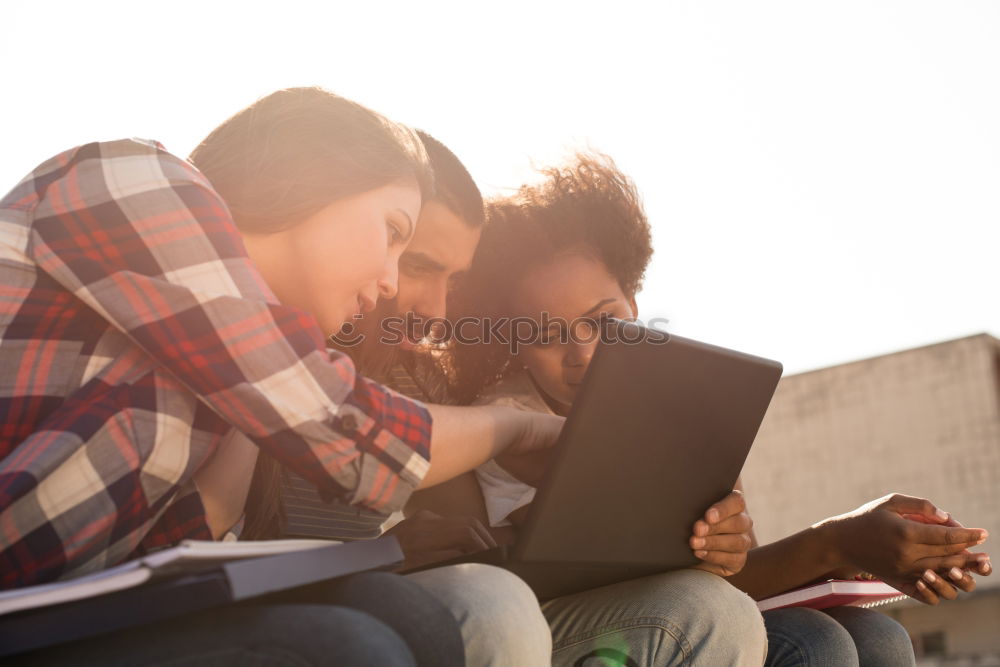 Similar – Image, Stock Photo Two teenagers in white sports shirts using tablet PC in cafeteria. They looking at pad screen