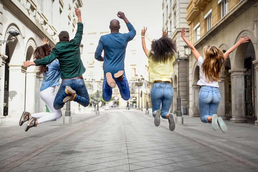 Image, Stock Photo Multi-ethnic group of young people having fun together outdoors in urban background.