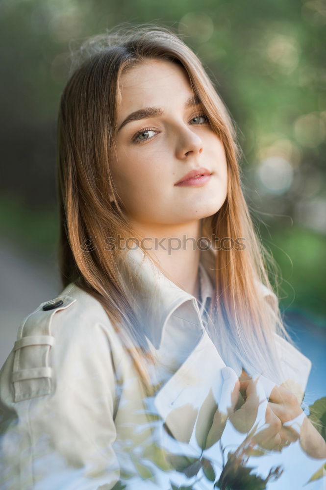 Portrait of a young teenager girl standing looking throughout the window